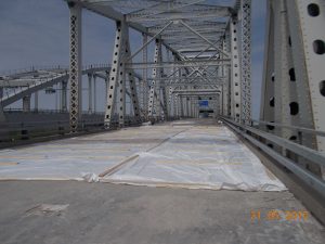 Covered concrete poured patches looking west