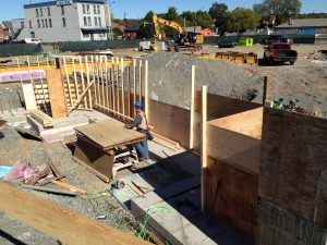 Outbound barrier wall and curbs