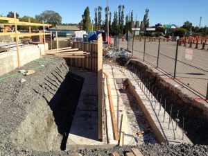 Outbound barrier wall and curbs