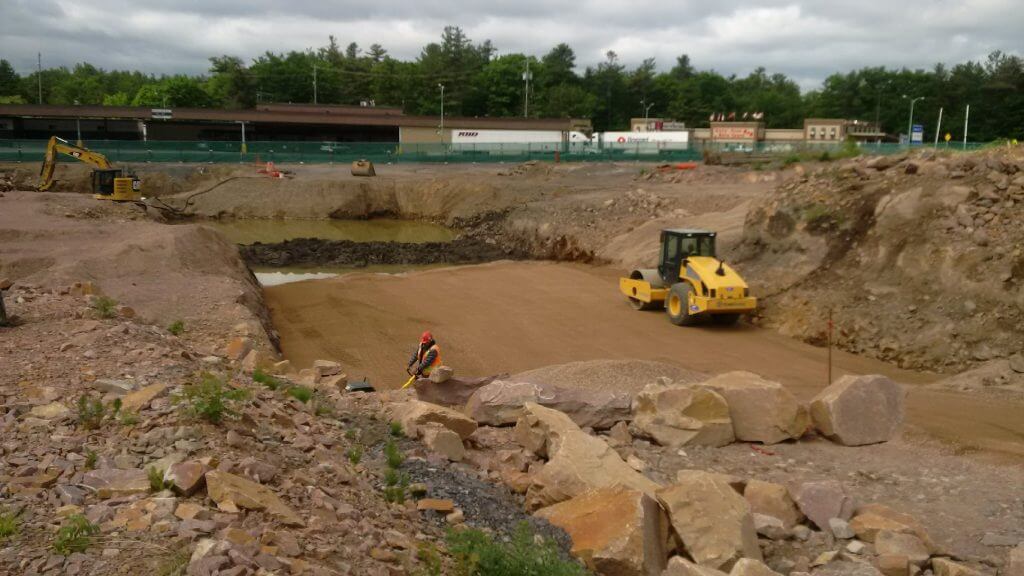 Additional backfill with engineered soil for building foundation 