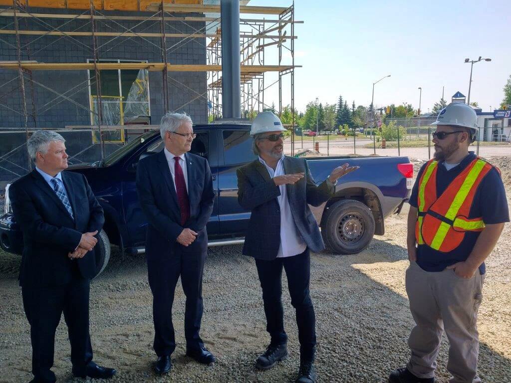 Franco Pastore, Principal - Director of Architecture with EPOH, explains the various steps of the ongoing project. On the right is FBCL Project Engineer   Jasper Boychuk .